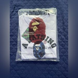 White bape shirt with blue camo logo